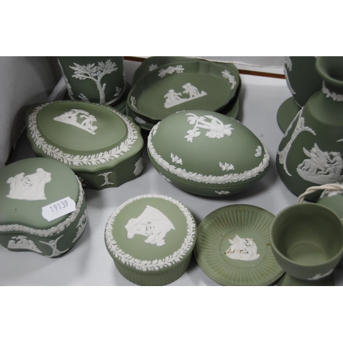 141 - Group of green Wedgwood Jasper ware to include boxes and covers, spill vases, cup, pin dishes etc.  ... 