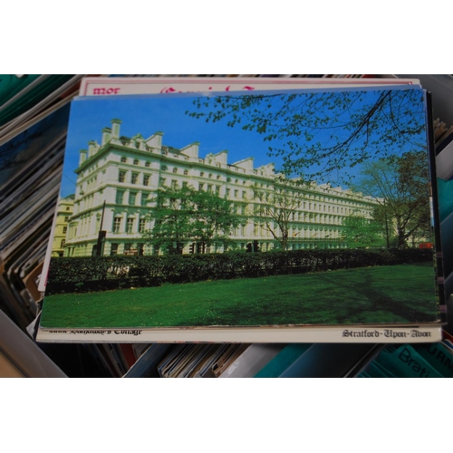 145 - Five boxes containing a large quantity of world postcards, sorted into countries.