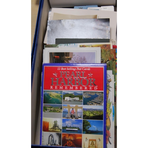 146 - Five boxes containing a large quantity of world postcards, sorted into countries.