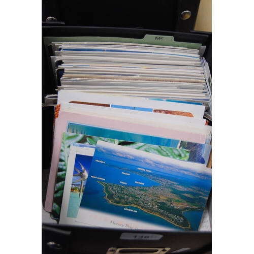 146 - Five boxes containing a large quantity of world postcards, sorted into countries.