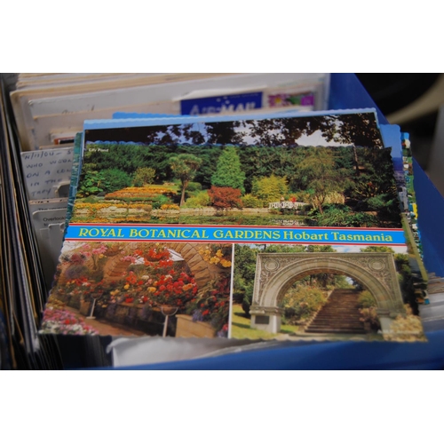 146 - Five boxes containing a large quantity of world postcards, sorted into countries.