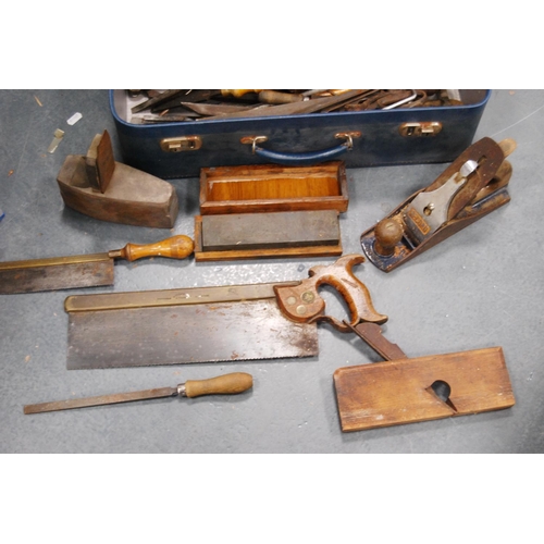 159 - Small suitcase containing a large quantity of antique and later woodworking tools to include saws, c... 