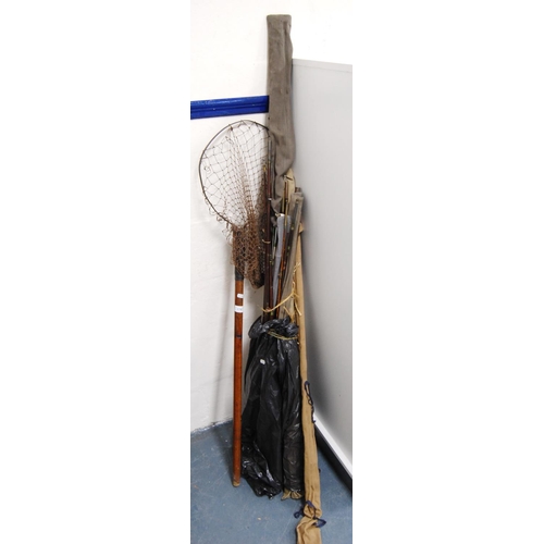 176 - Group of assorted fishing rods and a vintage fishing net.