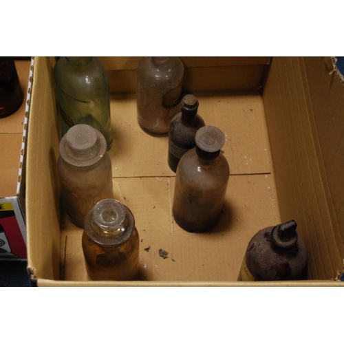 18 - Two cartons of vintage clear and coloured glass chemist's and apothecary bottles.