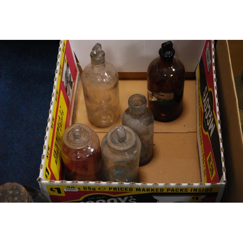 18 - Two cartons of vintage clear and coloured glass chemist's and apothecary bottles.