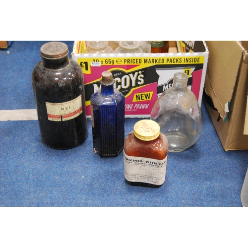 18 - Two cartons of vintage clear and coloured glass chemist's and apothecary bottles.