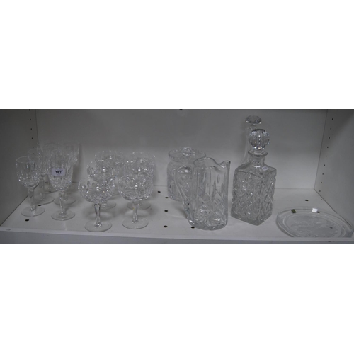 182 - Crystal and cut glass to include a Hoya thistle-decorated plate, two decanters, water jug, biscuit b... 