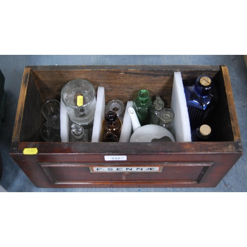 232 - Group of chemist's/apothecary bottles in brown, blue and clear glass, contained in a 19th century ap... 