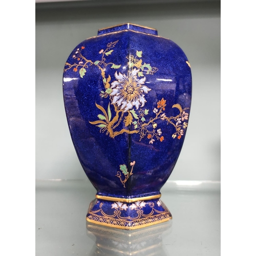 261 - Carlton Ware Wiltshaw & Robinson octagonal vase with enamel decoration on a blue ground.