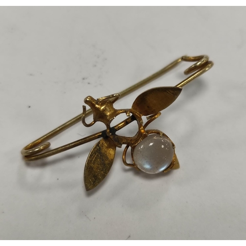 297 - Yellow metal star bracelet and a yellow metal bee brooch with moonstone-style inset.  (2)