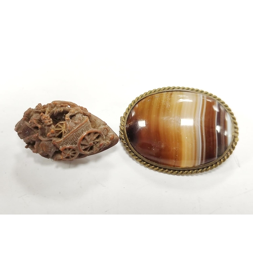 299 - Miniature Japanese wooden netsuke and a banded agate brooch.  (2)