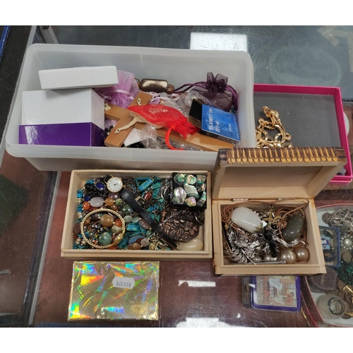 304 - Box of costume jewellery to include a crucifix, beads, fashion watches etc.