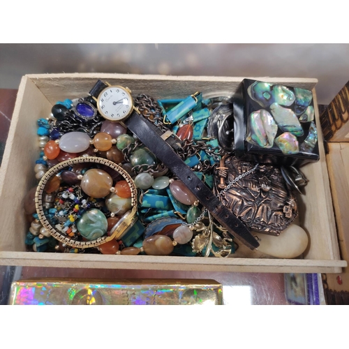 304 - Box of costume jewellery to include a crucifix, beads, fashion watches etc.