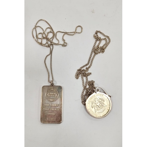 309 - 1oz silver ingot necklace and a .400 grade silver 1967 half dollar coin pendant on chain.  (2)