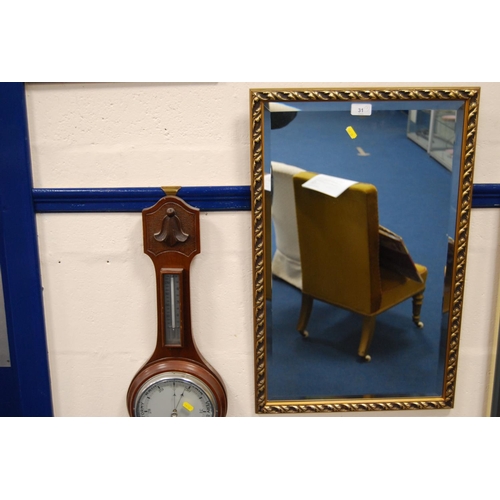 31 - Modern wall mirror and a wall barometer.  (2)