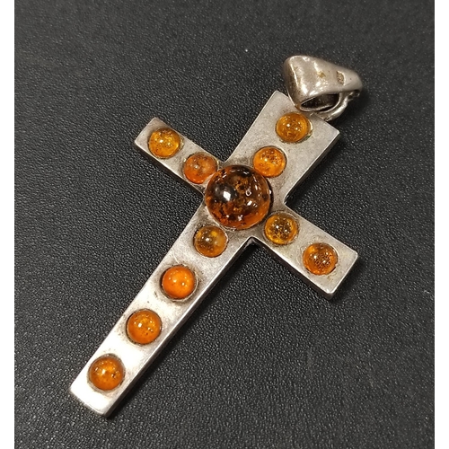 320 - Jewellery to include a silver cross pendant with amber-style stones, WRVS badges, metal bangle, napk... 