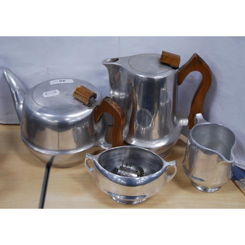 40 - Group of EP to include teapots, coffee pot, and a four-piece Picquot ware tea set.