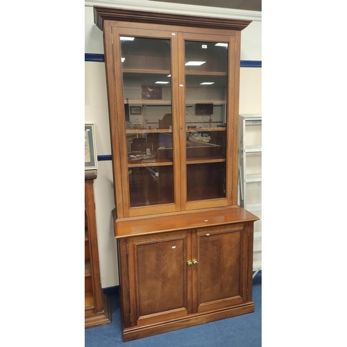 400 - Victorian-style two-door glazed bookcase on cupboard base.