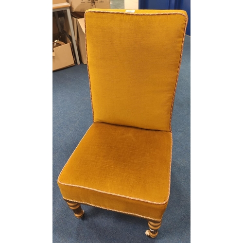 406 - Antique gilt wood nursing-type chair with later upholstery on ceramic castors.