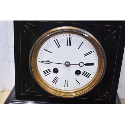 66 - Black slate mantel clock with twin train dial.