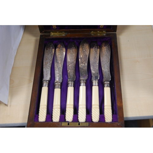 68 - Set of six EP fish knives and forks, banded in silver, with faux ivory handles, cased.