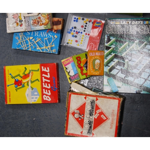 69 - Carton of various children's games and playing cards to include Monopoly, Beetle, Mastermind, Lexico... 