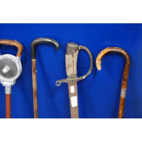 78 - Shooting stick, two walking sticks, one with a silver collar, and an antique sword (a/f).  (4)