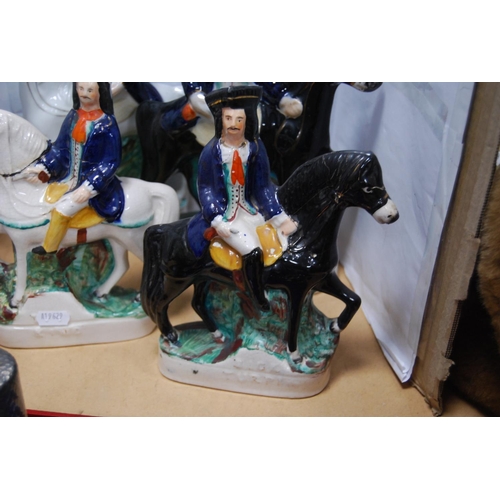 8 - Four 19th century Staffordshire flatback figures on horseback to include two each of Tom King and Di... 