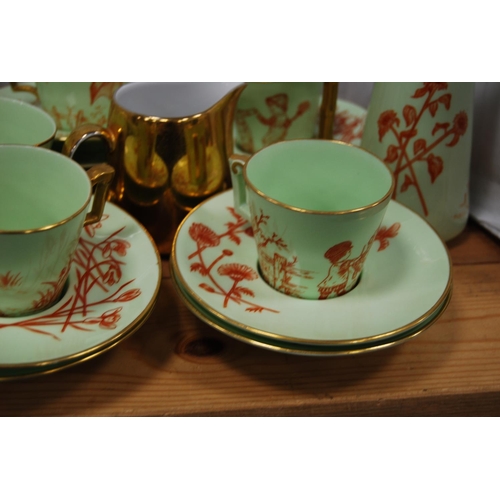 84 - Green and gilt glazed part tea/coffee set, signed 'MAP' to the underside to include teapot (15) and ... 