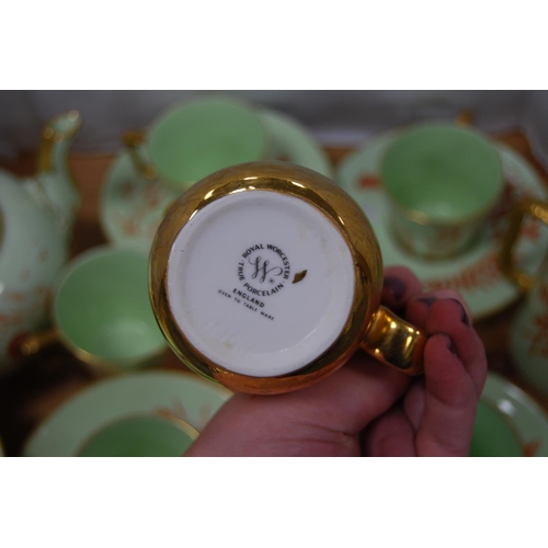 84 - Green and gilt glazed part tea/coffee set, signed 'MAP' to the underside to include teapot (15) and ... 