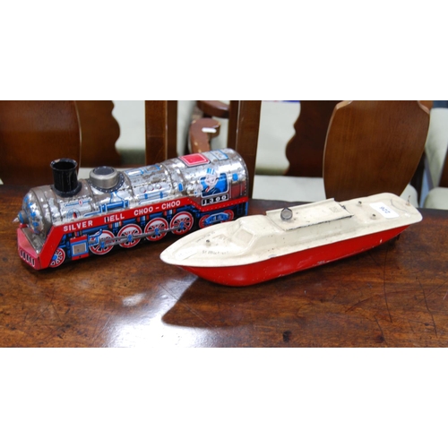 226 - Tinplate-style model of the 'Silver Bell Choo Choo' train, and a tinplate model of a boat's hull, 'S... 