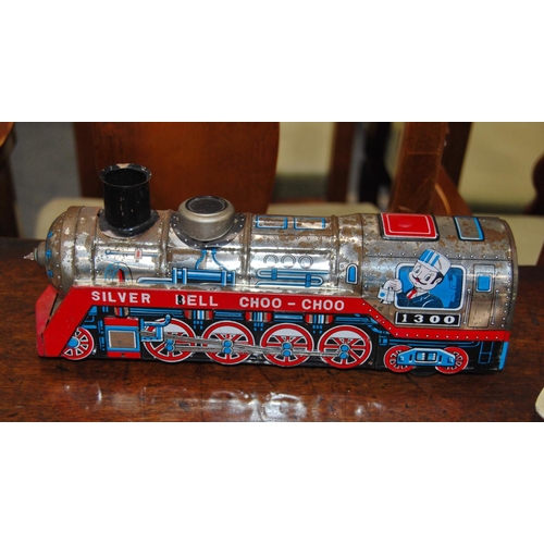 226 - Tinplate-style model of the 'Silver Bell Choo Choo' train, and a tinplate model of a boat's hull, 'S... 