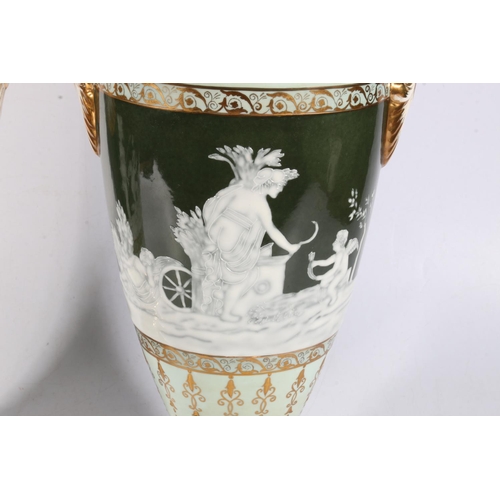 114 - Pair of modern porcelain urn vases with central band of pate sur pate Classical scenes in the style ... 