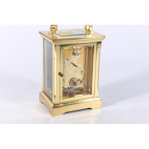 126 - French brass carriage clock, the backplate with 'ACG' monogram, 15cm tall. 