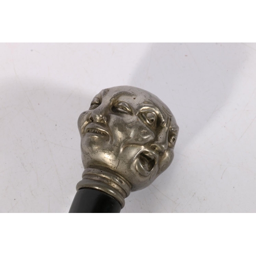 130 - Chinese ebony paperknife, the finial modelled as the four faces of Buddha in a chrome plated white m... 