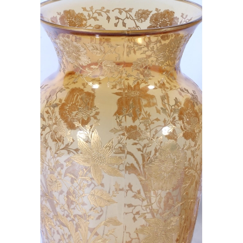 166 - Pair of amber coloured moulded glass baluster vases with applied gilded floral decoration in the man... 