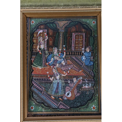 169 - INDIAN SCHOOL, a painted silk panel depicting an interior scene with figures partying and drinking, ... 