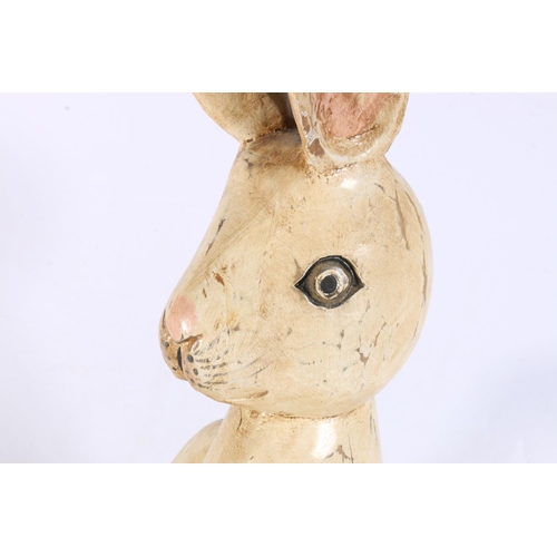 177 - Carved wooden model of a rabbit with articulated joints, 66cm tall.