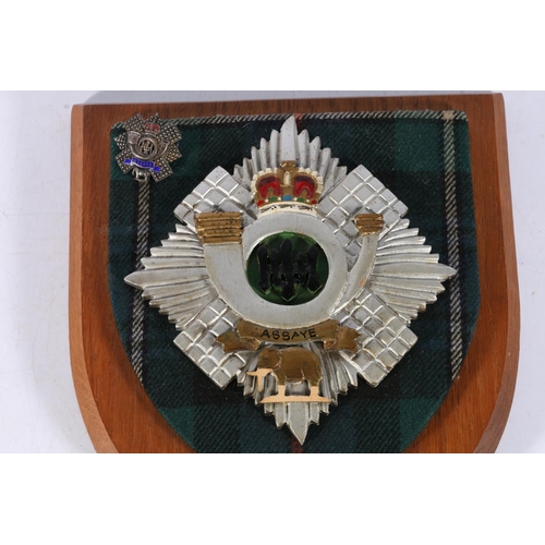 241 - Highland Light Infantry interest, a silver and enamel sweetheart brooch and a HLI shield plaque, als... 