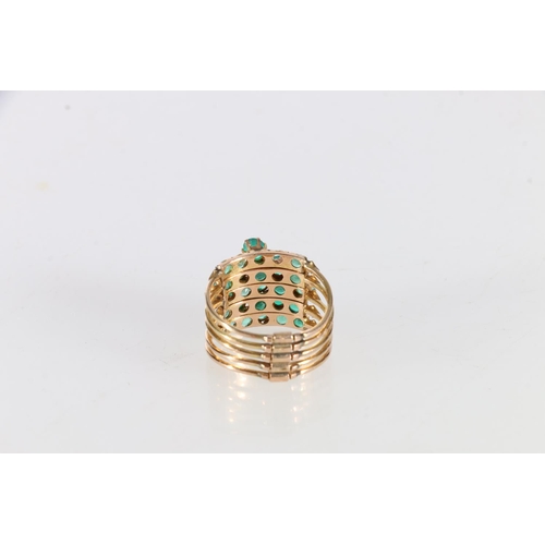 14K gold stamped green stone set ring constructed of five