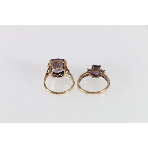 63 - 9ct gold faceted amethyst set dress ring and a 9ct gold purple stone and CZ set dress ring, size K a... 