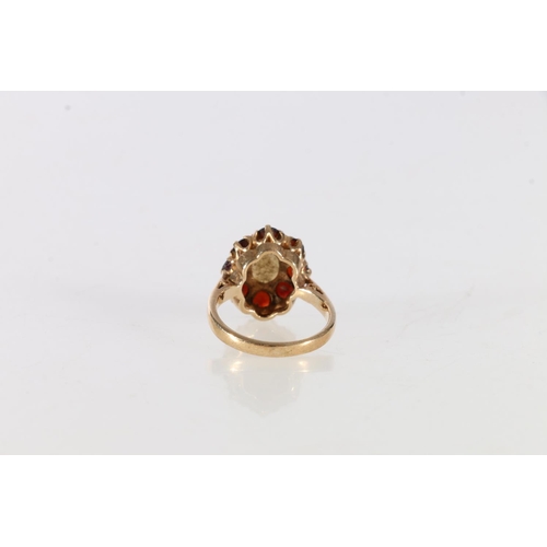 64 - 9ct gold opal and garnet set dress ring, size K, 3.6 grams