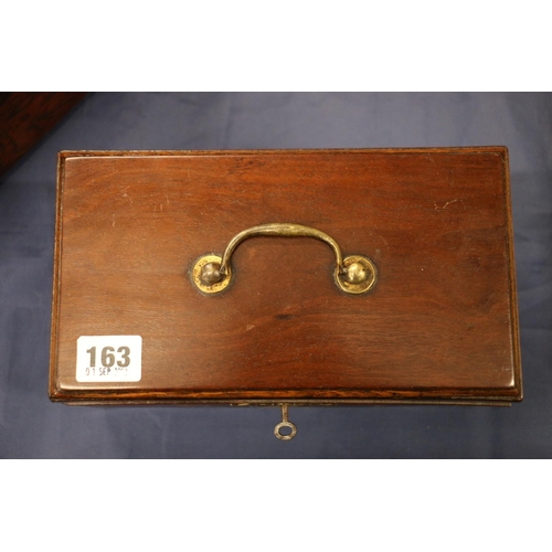 163 - Antique mahogany hinge top tea caddy, the lid opening to reveal a sectioned interior with two white ... 