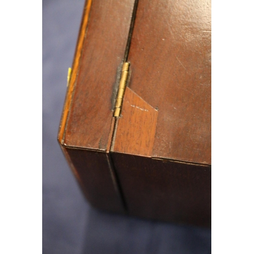 163 - Antique mahogany hinge top tea caddy, the lid opening to reveal a sectioned interior with two white ... 