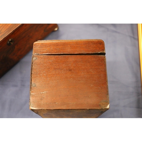 163 - Antique mahogany hinge top tea caddy, the lid opening to reveal a sectioned interior with two white ... 