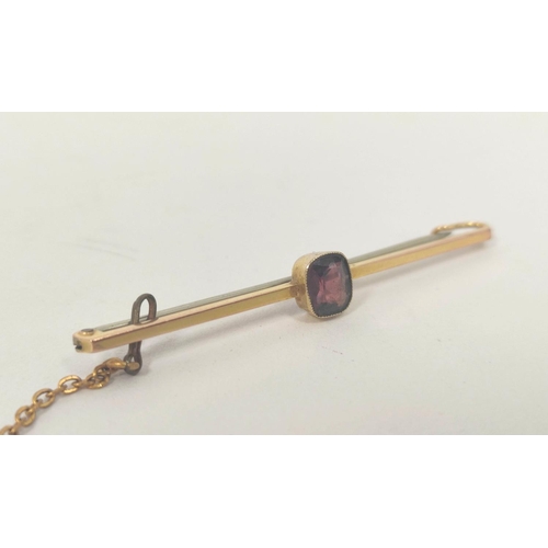 11 - 9ct gold bar brooch with garnet, a rolled gold cannon charm and sundry costume items.