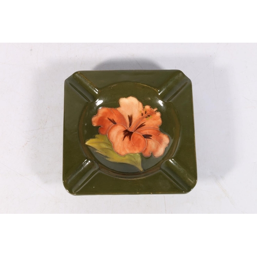 15 - Moorcroft hibiscus pattern ashtray, paper label to base, 12cm wide.