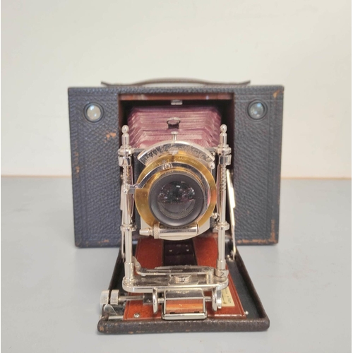 449 - Antique late Victorian Kodak Eastman No 4 model E folding box cartridge camera with red leather bell... 