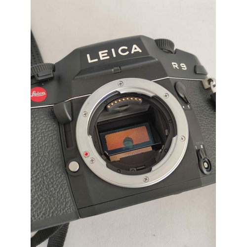 447 - Leica R9 SLR camera body, black, serial no. 2882832, with strap & box.