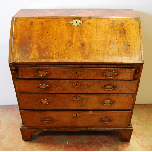 373 - Mid-18th century walnut bureau, the fall front enclosing drawers and pigeon holes, above four gradua... 